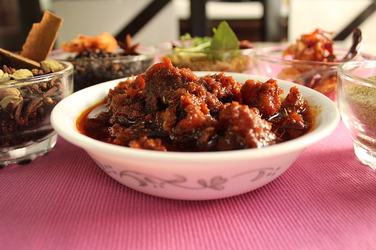 Photograph of spicy Indian chicken pickle in a bowl